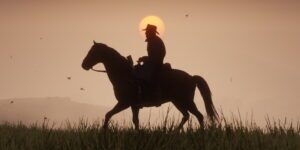 Arthur morgan riding his horse at sunset in red dead redemption 2